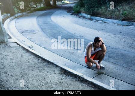 Jogger exhausted, taking break, Arroyo Seco Park, Pasadena, California, USA Stock Photo