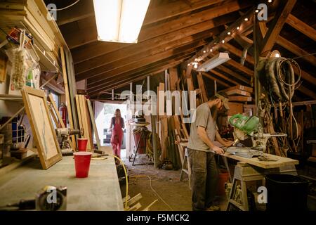 Wood artists working in workshop Stock Photo