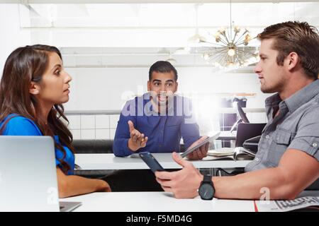 Small group of people having business meeting, male and female colleagues having disagreement Stock Photo