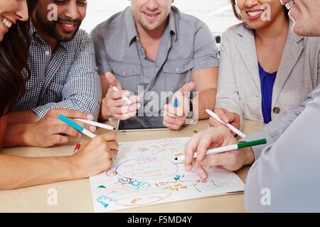 Small group of people having brainstorming business meeting Stock Photo