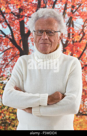 senior man posing forest background Stock Photo