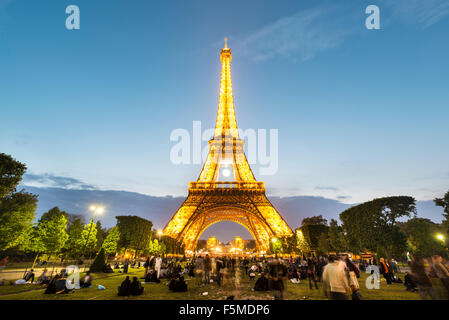Illuminated Eiffel Tower at dusk, tour Eiffel, Champ de Mars, Paris, Ile-de-France, France Stock Photo