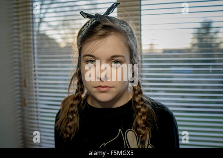 Head and shoulder photograph of a moody teenage girl Stock Photo