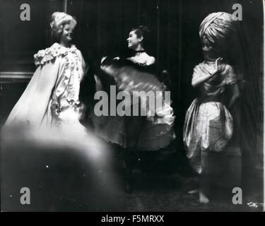 1972 - Charlie Chaplin's Daughter In Ballet Prologue The daughter of a famous comic may be on the way to becoming a famous ballerina. She is Geraldine Chaplin, 18-year-old daughter of Charlie Chaplin, and she is studying at the Royal School of Ballet. Geraldine, who bears a striking resemblance to her father, appears with other students of the Royal School in a prologue to a fashion show which the Queen Mother will see. Each character in the prologue will represent an associate member of the Incorporated Society of London Fashion Designers. Picture Shows:- Smiling Geraldine, centre, between tw Stock Photo