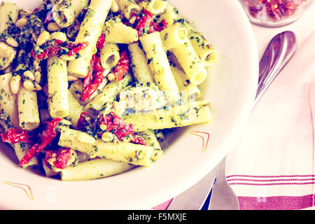 Pesto ziti with chicken in the plate in Italian restaurant. Stock Photo