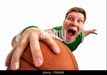 Portrait of bizarre basketball player shooting ball to basket. Isolated on white Stock Photo