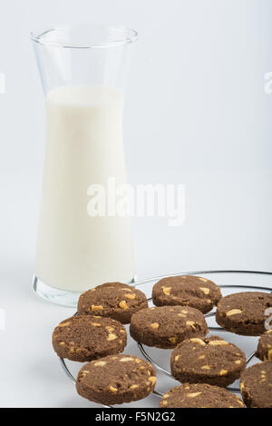 Milk and chocolate cookies placed on the grill  on white background Stock Photo