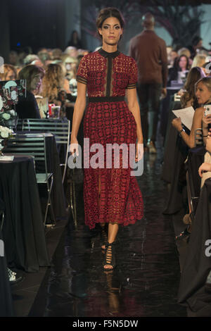 Calgary, Alberta, Canada. 6th Nov, 2015. A female model walks the Catwalk at HOLT RENFREW's Fashion Gala in Calgary wearing a dress by SELF PORTRAIT and carrying a handbag by GIVENCHY. Credit:  Baden Roth/ZUMA Wire/Alamy Live News Stock Photo