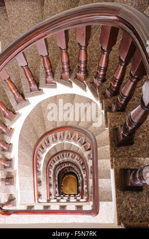 Vintage spiral staircase Interior in old house. Stock Photo