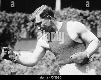 Vintage photo of early 20th century American boxer 'Fireman' Jim Flynn (1879 - 1935). Flynn (real name Andrew Chiariglione) twice fought for the World Heavyweight Championship - losing to Tommy Burns in 1906 and to Jack Johnson in 1912. He is also famous for knocking out future heavyweight champion Jack Dempsey in 1917 - the only man ever to do so. Stock Photo