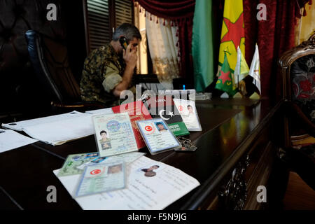Collection of Turkish identity cards and foreign passports found on the bodies of ISIS or ISIL fighters displayed in the headquarter of the Kurdish People's Protection Units YPG in the city of Qamishli or Qamishlo in Al Hasakah or Hassakeh district in northern Syria Stock Photo