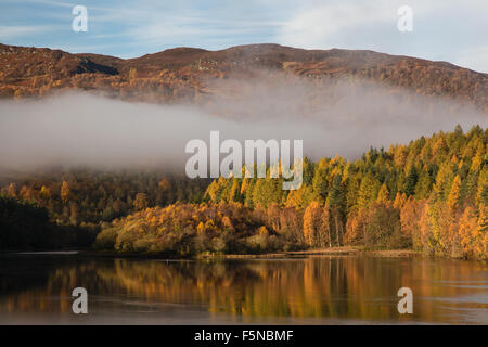 Autumn colors and mist at Loch Faskally, Pitlochry, Perthshire, Scotland Stock Photo