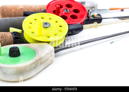 closeup ice-fishing rods, tackles and equipment on white background Stock Photo