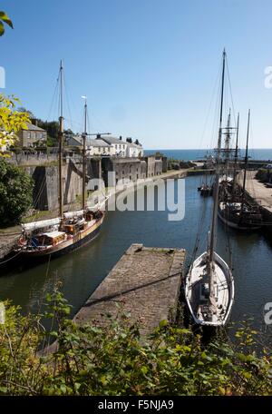 Tall ships in the harbour for the winter at Charlestown Cornwall on a autumn day, part of Poldark was filmed around the quay. Stock Photo