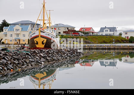Boat and colorful houses, harbor, Hofn, Iceland Stock Photo