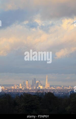 Epsom Downs, Surrey. 7th November 2015. After a day of wind and rain the storm finally passed just before dusk, with the sun casting a warm glow over the city of London, as viewed from Epsom Downs. Credit:  Julia Gavin UK/Alamy Live News Stock Photo