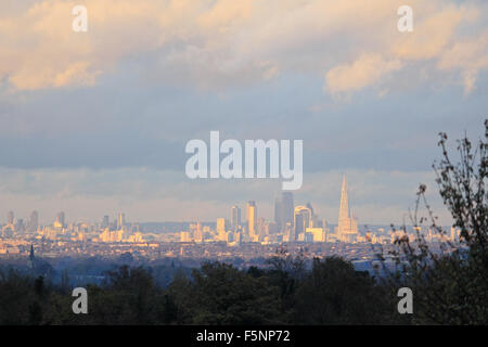 Epsom Downs, Surrey. 7th November 2015. After a day of wind and rain the storm finally passed just before dusk, with the sun casting a warm glow over the city of London, as viewed from Epsom Downs. Credit:  Julia Gavin UK/Alamy Live News Stock Photo