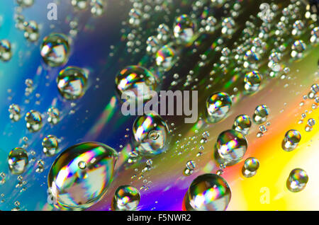 waterdrops on rainbow colors background selective focus Stock Photo