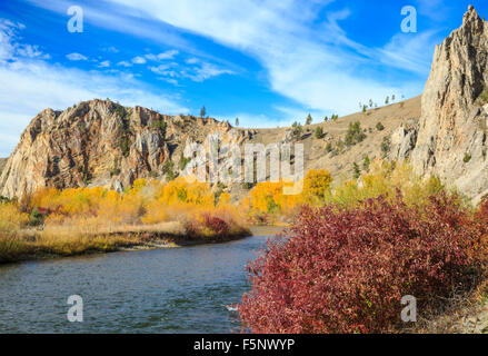 fall colors and cliffs along the clark fork river near bearmouth, montana Stock Photo