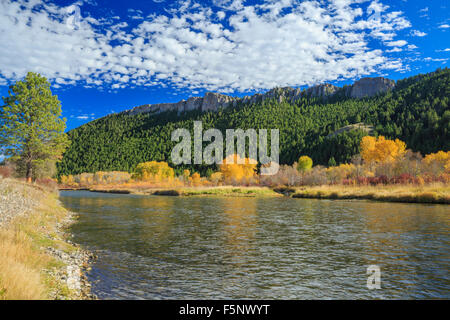 fall colors and cliffs along the clark fork river near drummond, montana Stock Photo