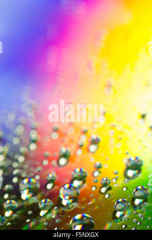 waterdrops on rainbow colors background selective focus Stock Photo