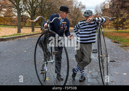 People in a traditional bicycle race. Prague Czech Republic Participants dressed in period costumes Stock Photo