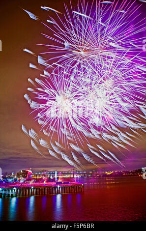 Purple Chrysanthemum aerial bomb explodes at a fireworks display in Montreal, Quebec, Canada. Stock Photo