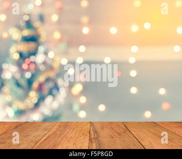 Greething Christmas the best of winter holiday. Wood plank with  sparkle blur bokeh for Christmas theme suitable for background Stock Photo