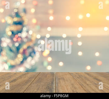 Greething Christmas the best of winter holiday. Wood plank with  sparkle blur bokeh for Christmas theme suitable for background Stock Photo