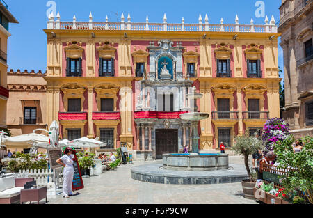 view of the Palacio Episcopal, Bishop's Palace with Plaza del Obispo Fountain at Plaza del Obispo, Malaga, Andalusia, Spain Stock Photo