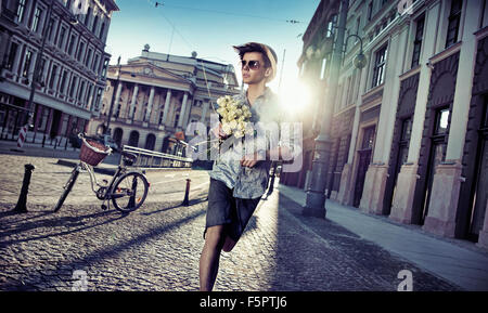 Handsome man looking for his lovely girlfriend Stock Photo