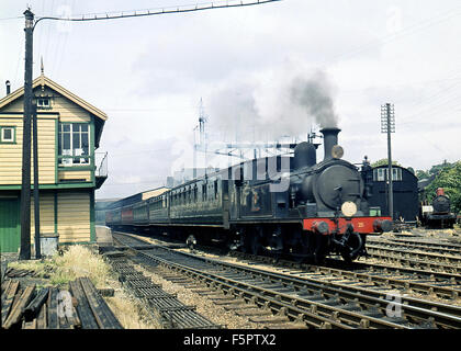 Steam train at Ryde St John's Road railway station on the Island Line, which serves the town of Ryde, Isle of Wight. 1959 Stock Photo