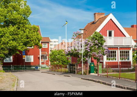 Red city during spring in Norrkoping. This is a picturesque residential area with old red wooden houses in Norrkoping, Sweden. Stock Photo