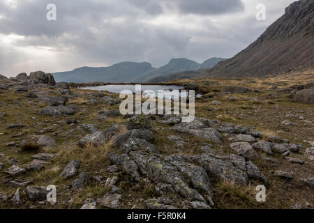 views of the scafell mountain range from three tarns and bowfell Stock Photo