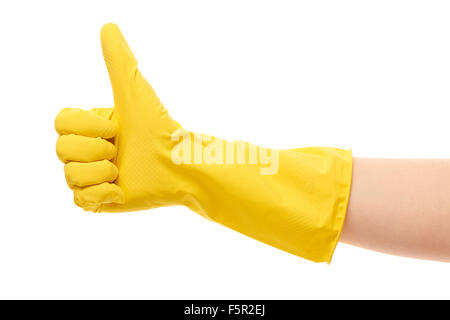 Close up of female hand in yellow protective rubber glove showing thumbs up sign against white background Stock Photo