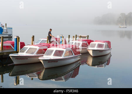 Hire boats being prepared on a misty morning on Lake Windermere