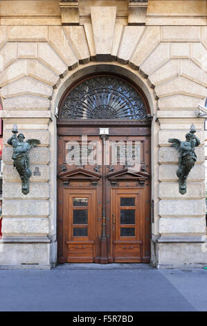 An old wooden door with fine carving in Budapest, Hungary. Stock Photo