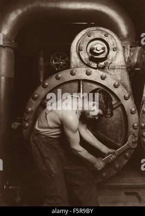 1920 photograph by Lewis Wickes Hine (American, 1874-1940) called Power House Mechanic. Stock Photo