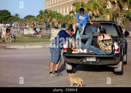 People picnicking at weekend near El Morro Fort, San Juan, Puerto Rico, Caribbean Stock Photo