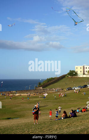 Kites in the sky and Puerto Ricans at weekend near El Morro Fort, San Juan, Puerto Rico, Caribbean Stock Photo