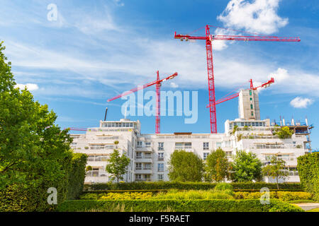 Construction Tower Cranes dominating a London Suburb skyline, England, UK Stock Photo