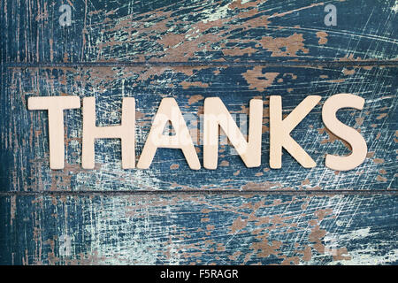 Word thanks written with wooden letters on rustic surface Stock Photo