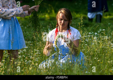 Young Woman Knitting Wreath of Daisies Girl in Meadow Folklore Costume Female Folk Dress Two Girls Dressed Traditional Folk Moravia Czech Republic Stock Photo