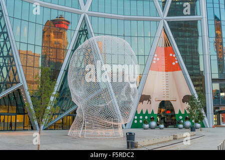 Sculpture titled 'Wonderland' by Jaume Plensa. The Bow Tower, Calgary, Alberta, Canada Stock Photo