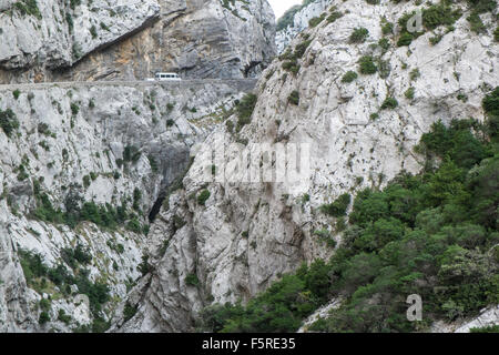 car,vehicle,on,winding,windy,road,Narrow road south of Quillan in Aude,Galamus,Gorge,Gorges de,limestone,cliffs,South,of,France, Stock Photo