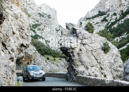 car,on,a,winding,windy,road,Narrow road south of Quillan in Aude,Galamus,Gorge,Gorges de,limestone,cliffs,France, Stock Photo