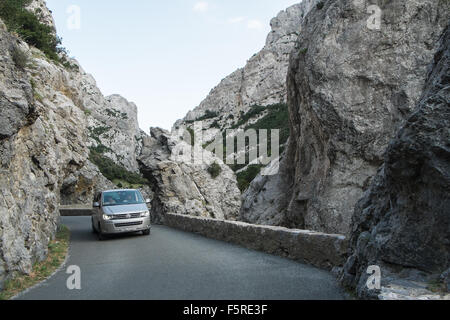 car,vehicle,on,winding,windy,road,Narrow road south of Quillan in Aude,Galamus,Gorge,Gorges de,limestone,cliffs,South,of,France, Stock Photo