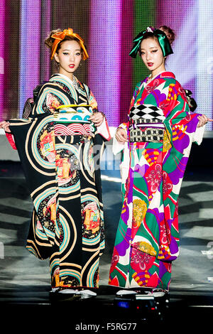 (L to R) Models Aya and Ami wearing Japanese kimono walk down the catwalk during the ''Moshi Moshi Nippon Festival 2015'' on November 7, 2015 in Tokyo, Japan. Japanese music stars and models attended the Moshi Moshi Nippon Festival 2015 with the aim of promoting Japanese pop culture (fashion, anime, music and food) to the world. For this year's Tokyo event visitors with a non-Japanese passport were allowed in for free and given priority seating. The event runs for three days until November 8th at the Tokyo Metropolitan Gymnasium. © Rodrigo Reyes Marin/AFLO/Alamy Live News Stock Photo