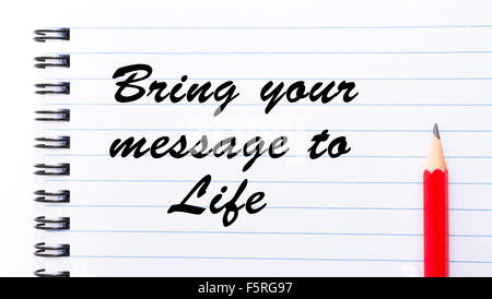 Bring Your Message To Life written on notebook page, red pencil on the right. Motivational Concept image Stock Photo