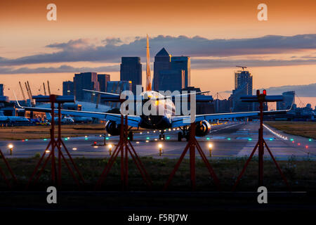 A passenger jet plane waiting to depart on the runway at London City Airport